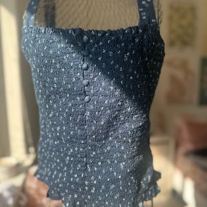 Medium Madewell dark blue tank top with light flower patterns.